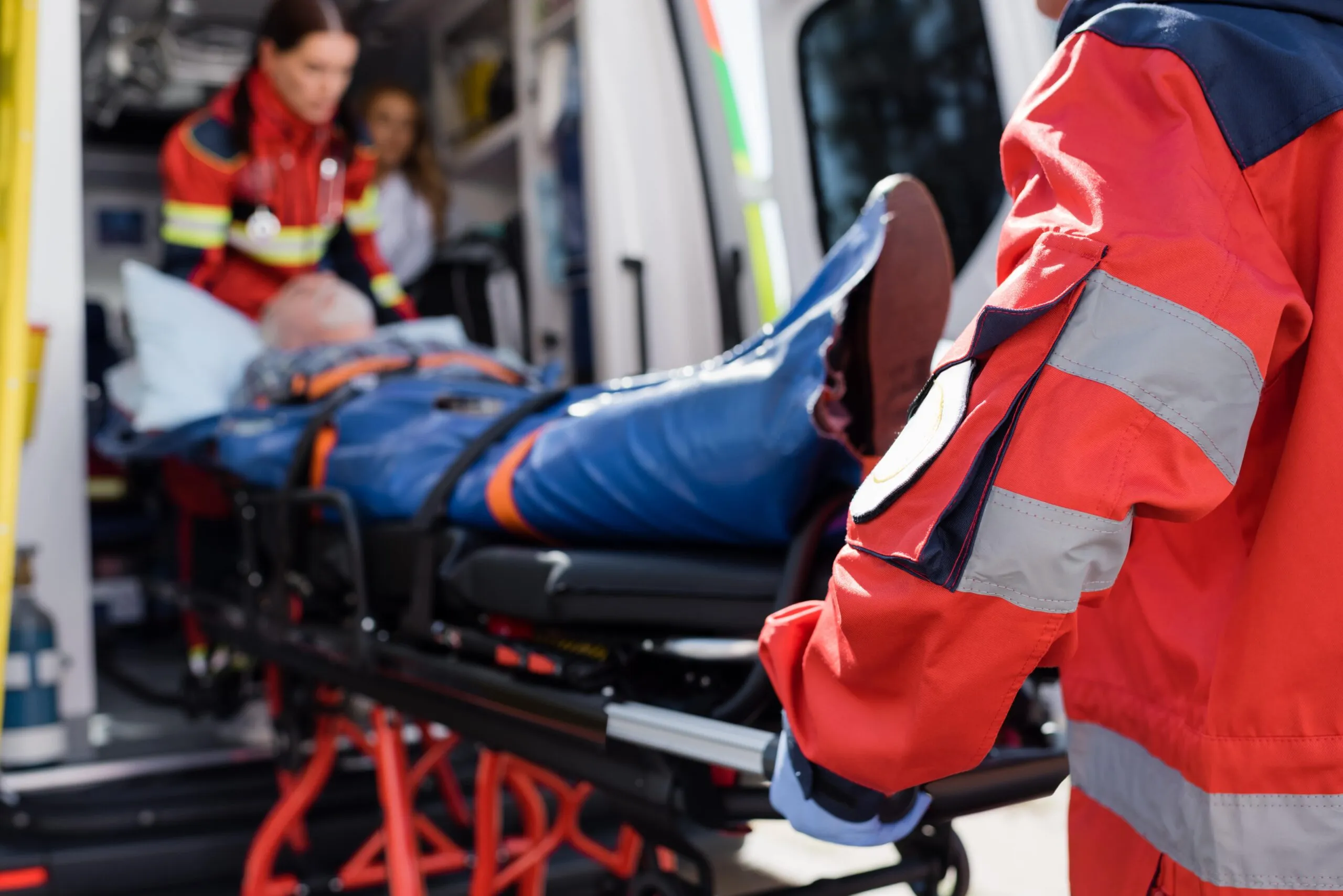 Man lays, strapped in a stretcher as he is pulled into an ambulance by EMT. Contact our catastrophic injury lawyers for a strong legal representative in Austin, TX if you’ve been severely injured in an accident.