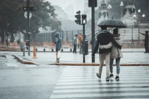 Pedestrians walking on a rainy day.
