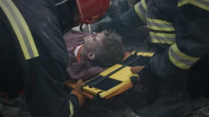 A man being carried on a stretcher.
