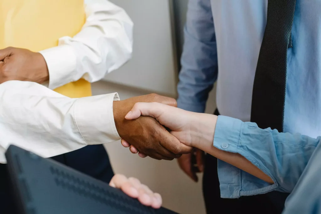 An attorney shaking hands with a client.