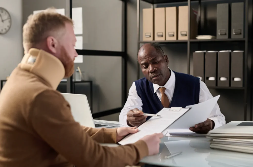 An attorney reviewing paperwork with a client.