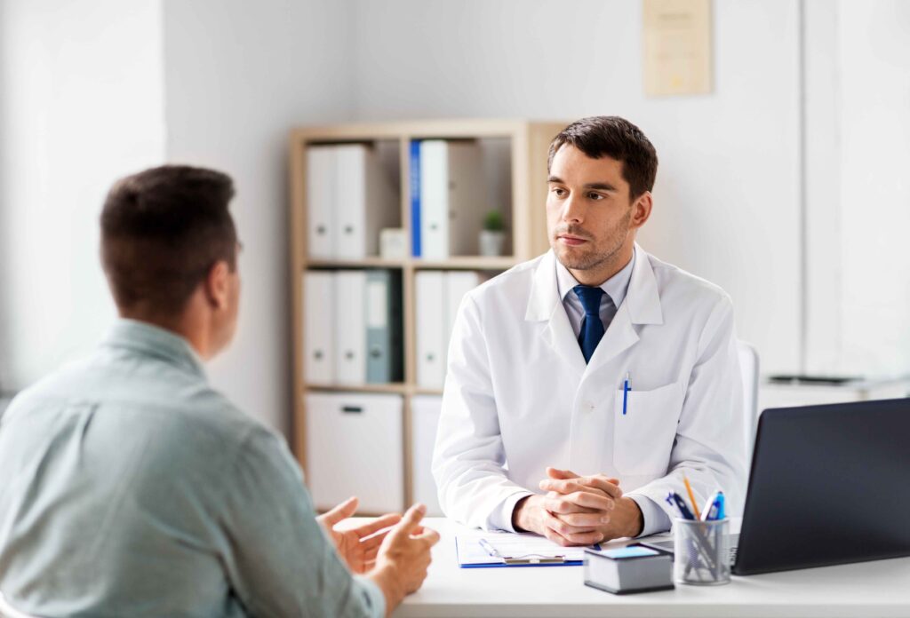 A doctor speaking with a patient.
